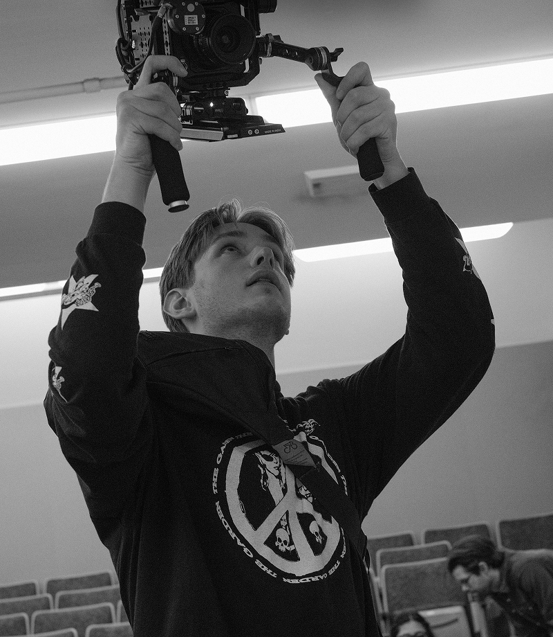 James McEntee holding camera on film set